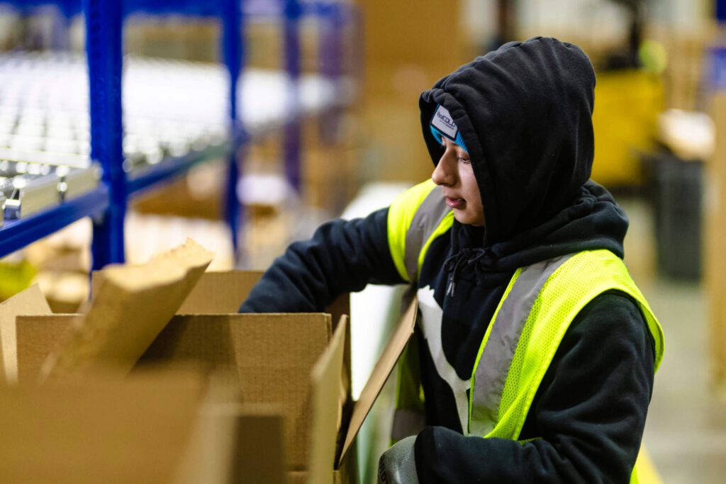 RealCold employee packing a DTC box